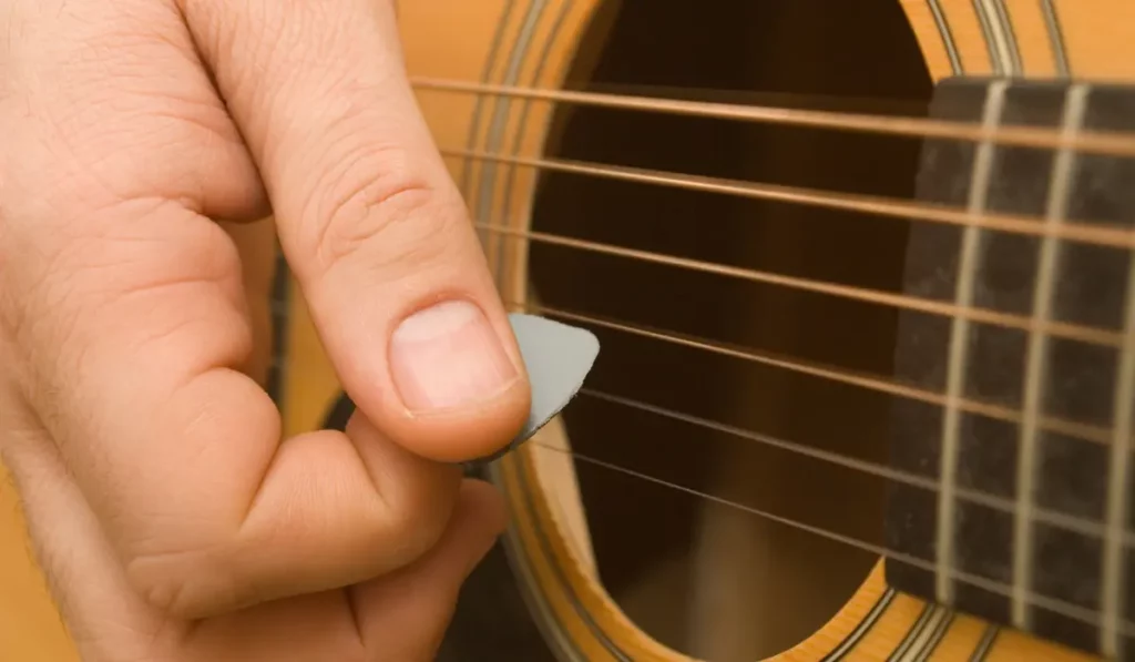 image showing Plucking a Guitar String as an example of transverse waves